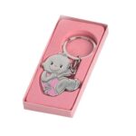 Llavero bebé niña sonriente, lacito y chupete